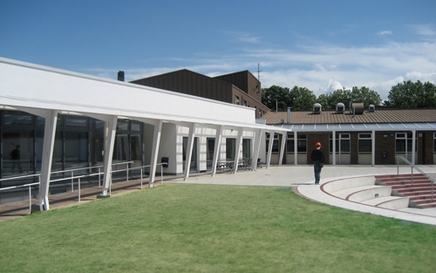 A stylish external canopy unites the new wing (above) and the sixties building (below)